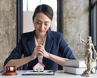 real-estate-concept-businesswoman-holding-a-house--L5LGMDP